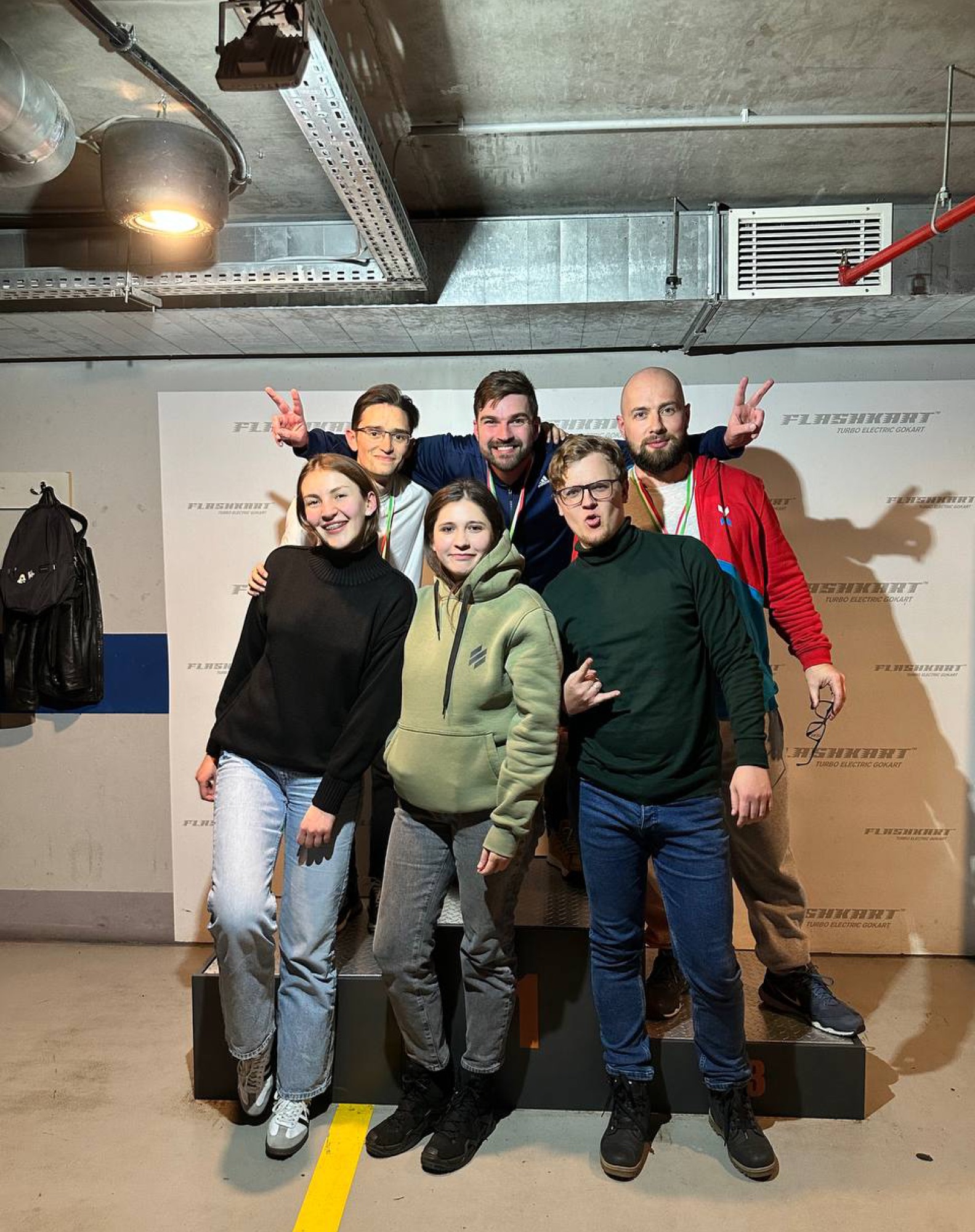 Max with his team at a karting track