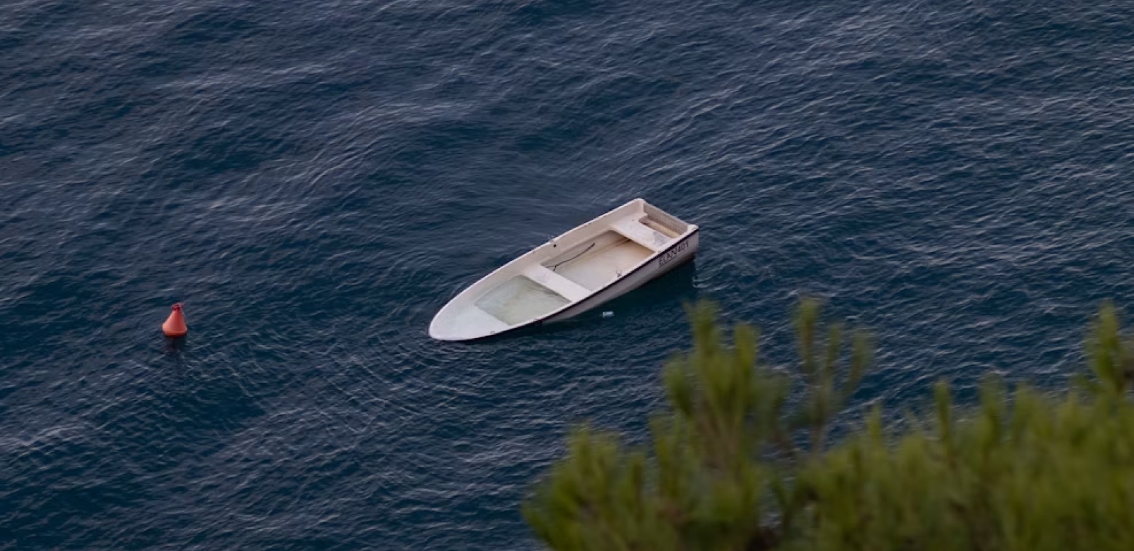 A boat on open water, one of Max’s Unsplash photos